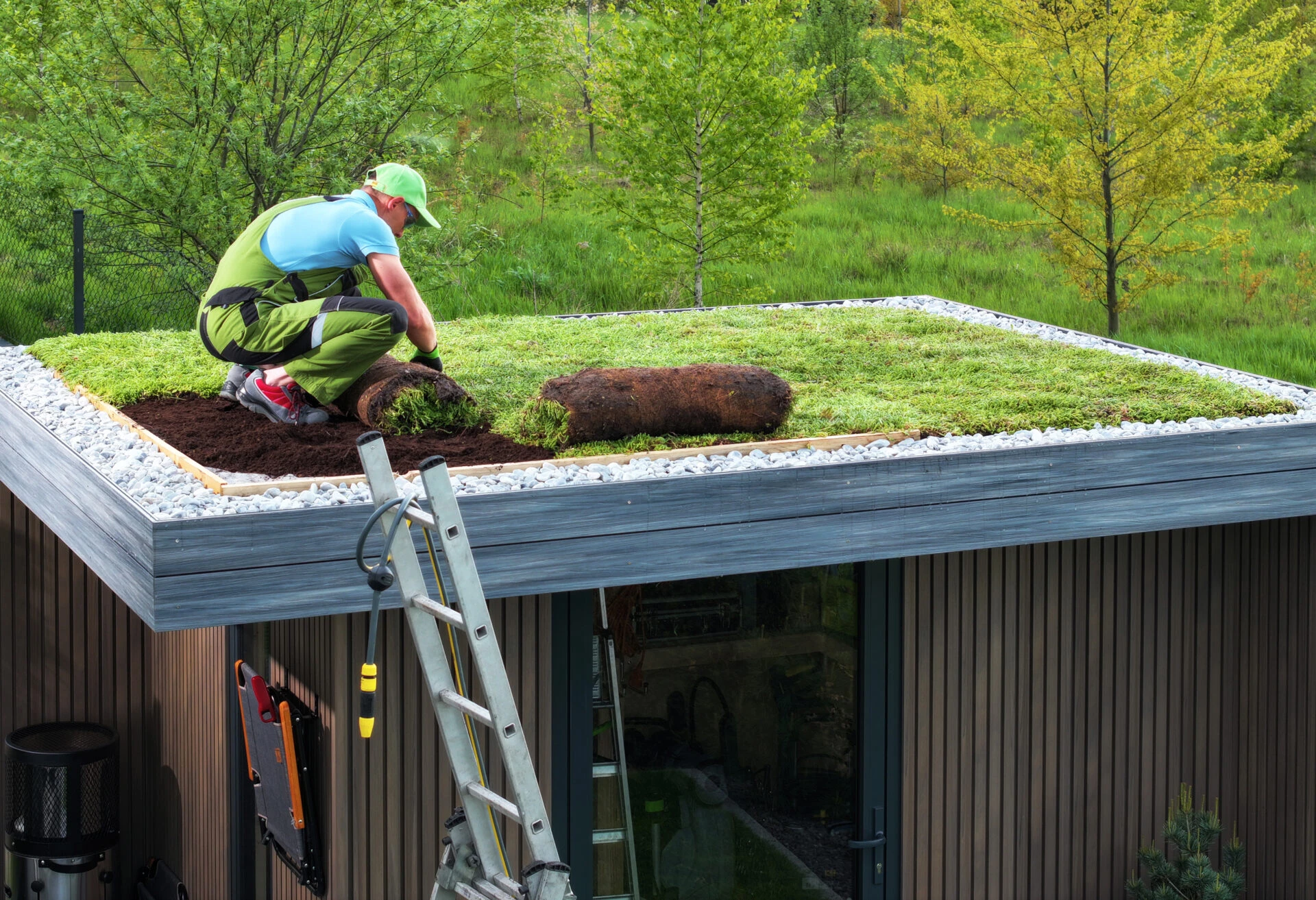 professional-gardener-building-sedum-green-roof-on-2023-05-16-02-09-46-utc